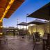 Fairfield by Marriott Inn & Suites Denver Airport at Gateway Park outdoor patio with tables, umbrellas and lights in Denver