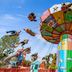 Holiday Inn Express Burton Upon Trent by IHG, Burton upon Trent: colorful swing ride against blue sky