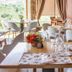 Hotel Rural Casa de Samaioes in Chaves dining room with set tables and countryside view