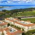 Kamer Exclusive Hotel & Suites in Cesme with sea view over rooftops and coastline