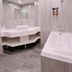 East Dragon Hotel Taipei City bathroom with double vanity, bathtub, gray tile walls and floor