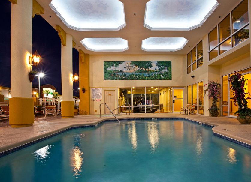 Holiday Inn Express & Suites Cocoa Beach By IHG indoor pool with skylit ceiling and lounge area