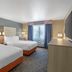Best Western Porterville Inn guest room with two double beds and window view in Porterville