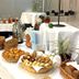 Hotel Sonneck in Schwäbisch Hall buffet table with bread rolls, baskets, pastries, and juice bottles