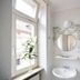 Hotel Goldener Hecht in Heidelberg bathroom with sink, round mirror, window and towel rack