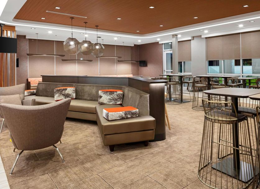 SpringHill Suites by Marriott Beaufort lobby lounge with seating and bar-height tables