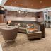 SpringHill Suites by Marriott Beaufort lobby lounge with seating and bar-height tables