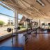 Hotel Marina Villa del Rio gym in Valdivia with treadmills, weights and large windows