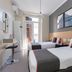 Ch Las Murallas in Madrid: twin guest room with two single beds and a doorway to a balcony or terrace.