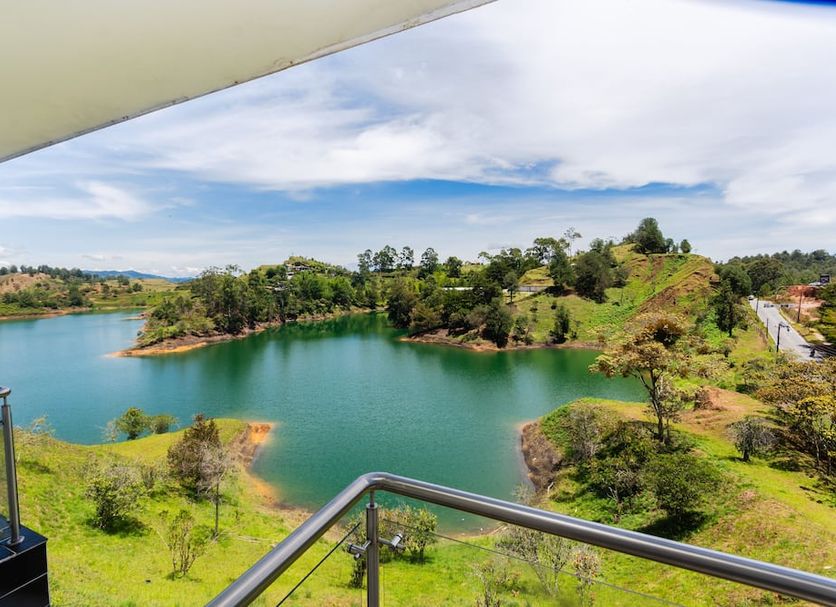 Hotel Verony Guatape in Guatapé with balcony view of the lake and green hills