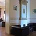 Boutique Hotel Argo, Kutaisi: lobby seating with black leather chairs and decorative wall mirror