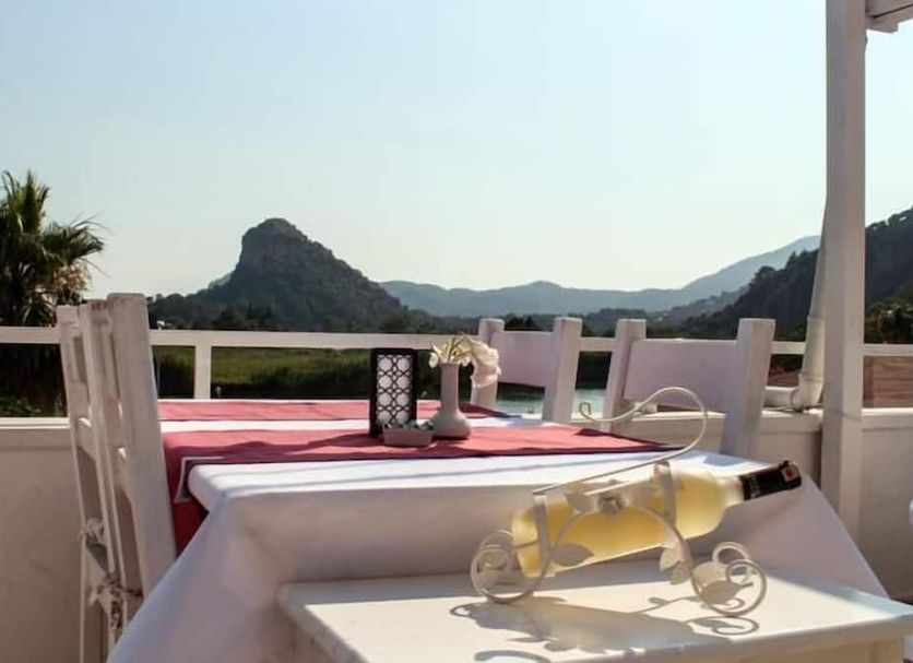 Dalyan Terrace Hotel in Dalyan, Mugla, with a terrace table and mountain view
