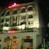 Hotel Amar Vilas in Indore, lit hotel exterior at night with arched windows and balconies