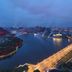 DoubleTree by Hilton Anshun with river and lit bridge city view at dusk in Anshun