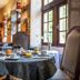 Château de la Caze in Gorges-du-Tarn-Causses, elegant dining room with set table and tall windows