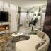 Iris Hotel, Erbusco: stylish lounge with electric fireplace, wall-mounted TV, curved sofa and seating area