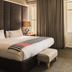 Asara Wine Estate & Hotel in Stellenbosch guest room with king bed and balcony view