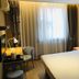 Home Inn Dalian Jinzhou Railway Station Stadium guest room with double bed, desk and window