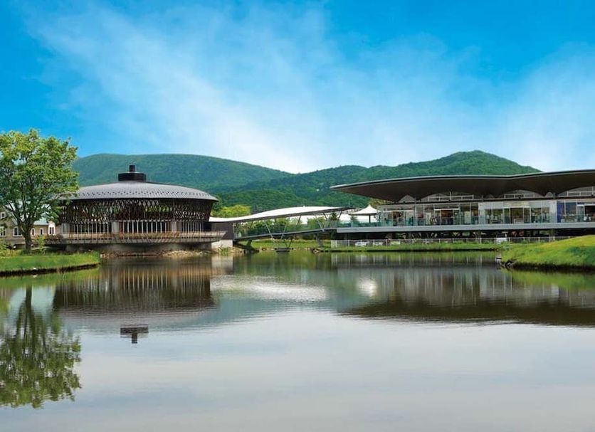 Karuizawa Asama Prince Hotel in Karuizawa with lakeside buildings, mountain views and reflections