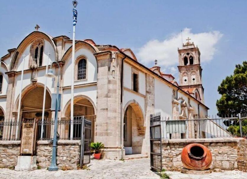 Lazaros Stonehouse in Larnaca, stone church-style exterior with arched entrance and bell tower