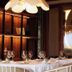 Casa Bassa in Valencia restaurant with set dining tables, wine glasses, and warm pendant lighting