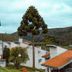 Plaza Inn Week Inn in Campos do Jordão with chalet-style buildings and hillside mountain views