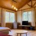 Mhuwe hotspring room in Ren-ai Township with wood-paneled walls, large windows, and TV