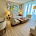 Lyfe Resort And Residences in Hollywood living area with sofa, armchairs, coffee table and floor-to-ceiling windows