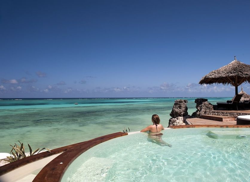 Karafuu Beach Resort & Spa in Zanzibar with an oceanfront infinity pool overlooking turquoise water