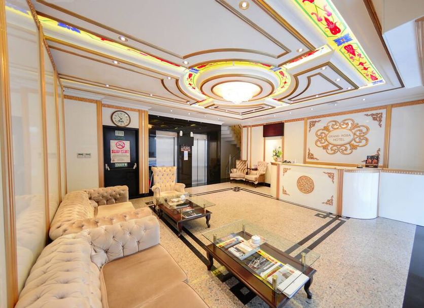 Grand Rosa Hotel Istanbul lobby with ornate ceiling, tufted sofa and seating area