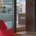 Aparthotel Fleming 50 - Adults Only lounge with red cushions and a view of the terrace in Sant Antoni de Portmany