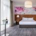 Moyvalley Hotel & Golf Resort in Moyvally bedroom with floral mural headboard, king bed, and floor lamp