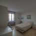 Sogni D'oro Guest House Florence bedroom with double bed, nightstands, wall art and window light