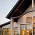 Residence Inn by Marriott Lincoln South exterior at dusk with modern peaked roof and large windows