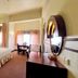 Hotel Sibayak International, Berastagi: spacious guest room with double bed, desk, and large mirror