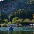 Dalyan Terrace Hotel in Dalyan, Mugla, with river boats and cliffside rock tombs