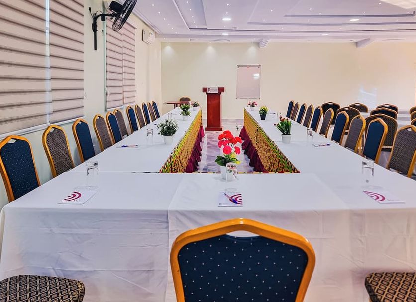 Rhogem Hotel, Takoradi: conference room with U-shaped meeting table and blue chairs