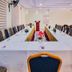 Rhogem Hotel, Takoradi: conference room with U-shaped meeting table and blue chairs