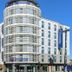 Travelodge London Kingston Upon Thames exterior in Kingston upon Thames with curved glass facade