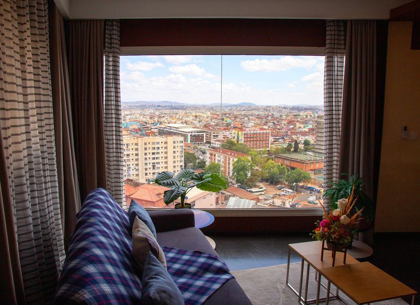 Hotel La Villette in Antananarivo with large window city view and seating area