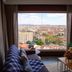 Hotel La Villette in Antananarivo with large window city view and seating area