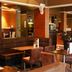 Great Western Hotel Aberdeen in Aberdeen dining area with brown booths, tables and warm wood-paneled interior