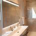 Le Manoir des Impressionnistes - Bord de Mer bathroom with double sink, mirror, and glass shower in Honfleur