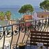 Rosy Suites Hotel in Kusadasi with sea-view balcony overlooking the coast and trees