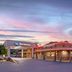 Best Western East Zion Thunderbird Lodge in Mount Carmel at dusk, with restaurant and parked cars