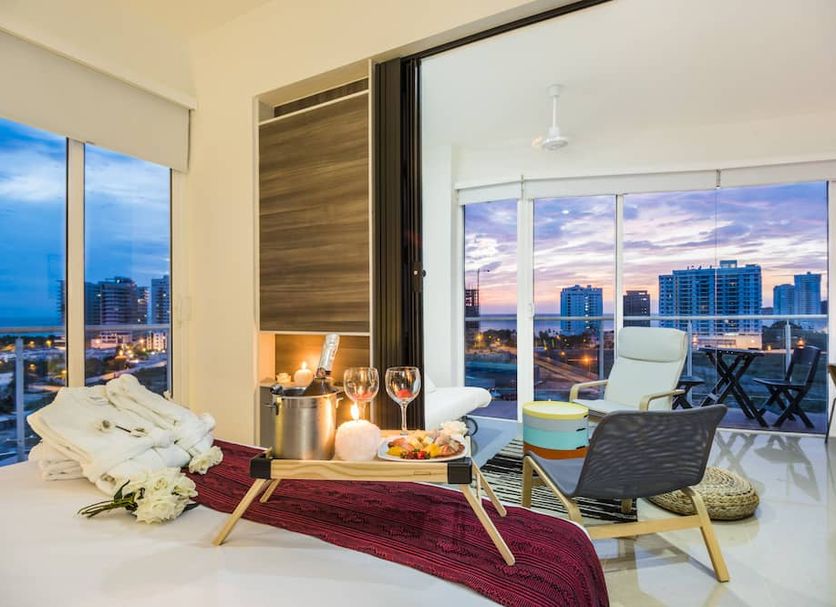 Terrazas Tayrona Travelers Apartamentos y Suites in Santa Marta, balcony suite with city and sunset views