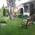 The Grateful Bed B'n'B in Prince George with a landscaped garden and outdoor seating beside the building