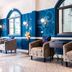 Sabai Mansion Pool & Spa in Krabi lobby with blue walls, arched windows and velvet armchairs