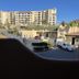 Studio Suite at Marina Cabo Plaza in Cabo San Lucas with marina-area building and palm-lined street