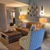Pelican Beach Resort & Conference Center in Destin lobby seating area with sofa, armchair and lamps